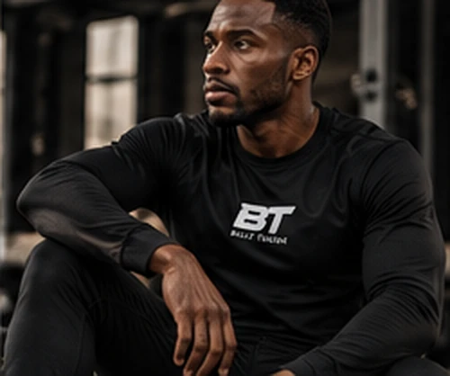 Athletic male model wearing a Built Tough black tee